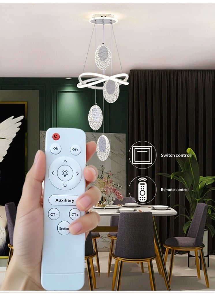 An LED pendant light with 4 oval lamp heads, featuring three different lighting colors that can be adjusted. It can be controlled via remote control or switch. The height is adjustable. Suitable for above the dining table, bedroom, and living room. Adjustable, suitable for the dining area. - Image 3